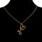 gold stethoscope shaped necklace with heart